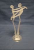 AN UNUSUAL ART GLASS FIGURE OF A COUPLE EMBRACING