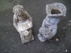 TWO CONCRETE GARDEN ORNAMENTS TO INCLUDE A CONCRETE TOBY JUG PLANTER BOY READING STATUE