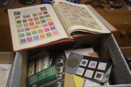 A COLLECTION OF STAMPS AND CIGARETTE CARDS IN ALBUMS