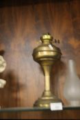 A BRASS OIL LAMP WITH CHIMNEY