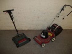 A MOUNTFIELD ELECTRIC LAWN MOWER AND A BLACK & DECKER LAWN RAKE