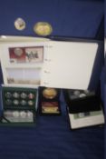 A COLLECTION OF BOXED COMMEMORATIVE AND OTHER COINS TOGETHER WITH AN ALBUM OF FIRST DAY COVERS