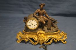 A VINTAGE METAL AND GILT MANTLE CLOCK