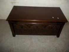 AN ANTIQUE CARVED SOLID WOOD COFFEE BLANKET CHEST