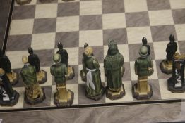 A UNBOXED STUDIO ANNE CARLTON CHESS SET |AMERICAN INDEPENDENCE|