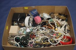 A BOX OF ASSORTED COSTUME JEWELRY
