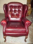 A MODERN LEATHER WING BACKED QUEEN ANN STYLE CHAIR