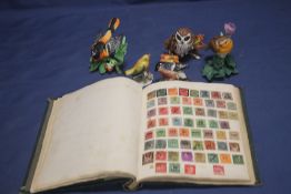 A VINTAGE STAMP ALBUM TOGETHER WITH A COLLECTION OF CERAMIC BIRD ORNAMENTS