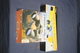 A BOXED SET OF BRESSER 10/50 BINOCULARS AND A BOXED LAND AND SKY TELESCOPE