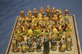 A UNBOXED STUDIO ANNE CARLTON CHESS SET TOGETHER WITH ANOTHER, TO INCLUDE CRUSADES AND VIKINGS