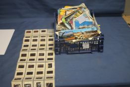 A QUANTITY OF STAMPS, POSTCARDS, AND PHOTOGRAPHIC SLIDES