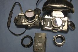 A NIKON F CAMERA TOGETHER WITH A NIKO CAMERA AND A QUANTITY OF ACCESORIES