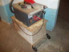 A TABLE TOP SAW AND HOME MADE STAND