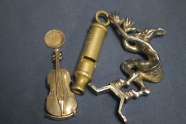 A SMALL DEVIL CAR MASCOT, VIOLIN VESTA CASE, WHISTLE AND A SIXPENCE