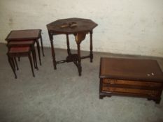 AN ANTIQUE OAK CARVED TABLE A REPRODUCTION MEDIA STAND AND A REPRODUCTION LEATHER INLAID NEST OF 3