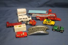 A QUANTITY OF ASSORTED TOY VEHICLES TOGETHER WITH A TRIUMPH CAR BADGE