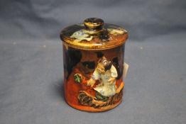 AN UNUSUAL ORIENTAL LIDDED POT WITH APPLIED FIGURE