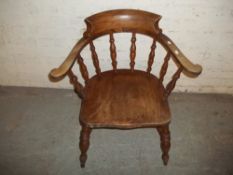 AN ANTIQUE SMOKERS BOW CHAIR