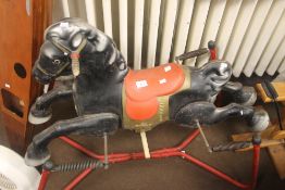 A VINTAGE CHILDS MOBO HORSE