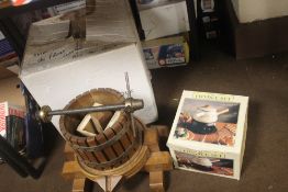 A BOXED APPLE PRESS TOGETHER WITH A FONDUE SET