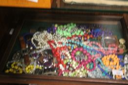 A DISPLAY CABINET CONTAINING JEWELLERY AND WATCHES