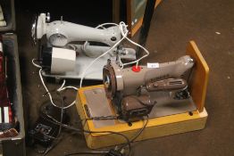 A SINGER SEWING MACHINE TOGETHER WITH ANOTHER