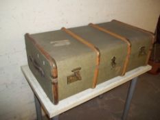 A FOUR BANDED STEAMER TRAVEL TRUNK