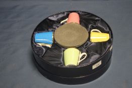 A BOXED ROYAL WORCESTER HARLEQUIN COFFEE SET