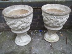 A PAIR OF LARGE CONCRETE GARDEN URNS