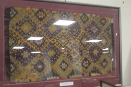 A FRAMED AVANOS TURKISH RUG 105 CM X 75 CM