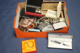 A BOX OF ASSORTED COSTUME JEWELRY