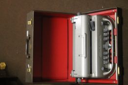 A CASED PERKINS BRAILER