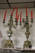 A PAIR OF CONTINENTAL STYLE BRASS CANDLEABRAS