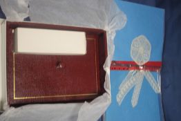 A FOLDER CONTAINING LACE SAMPLES TOGETHER WITH A LIDDED BOX