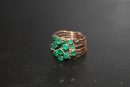 A CONTINENTAL FIVE BAND MULTI SECTION RING SET WITH EMERALDS, STAMPED 14A, APPROX 6.3 G, RINGS