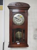 A VINTAGE MAHOGANY WALL CLOCK