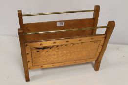 A VINTAGE COPPER AND WOOD MAGAZINE RACK