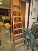 A SET OF VINTAGE WOODEN STEP LADDERS