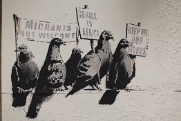 A MODERN METAL FRAMED MIRROR TOGETHER WITH A BANKSY PRINT ON CANVAS PLUS ANOTHER (3)