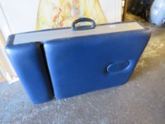 A PORTABLE FOLD-UP MASSAGE / TREATMENT TABLE
