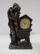 A BRONZED STYLE RESIN FIGURAL MANTEL CLOCK