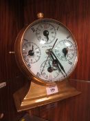 AN UNUSUAL LARGE BRASS COMPASS / CLOCK