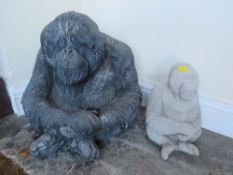 A CONCRETE SEATED GORILLA GARDEN ORNAMENT AND A SMALLER EXAMPLE (2)