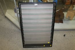 A MODERN WALL HANGING DISPLAY CASE