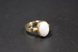 A HALLMARKED 9CT GOLD OPAL SET DRESS RING, opal within a rub over mount approx W 10 cm, H 12 mm,