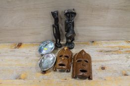 TWO AFRICAN TRIBAL ART FIGURES, TWO FACE MASKS AND TWO PAUA SHELLS FROM NEW ZEALAND