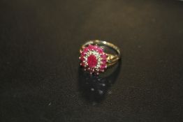 A HALLMARKED 9CT GOLD RUBY AND DIAMOND CLUSTER RING, APPROX 3.9 G, RING SIZE K-L