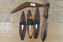 THREE AUSTRALIAN ABORIGINAL WOODEN MINIATURE SPEAR THROWERS (WOOMERA'S) WITH BONE BARBS, A SMALL