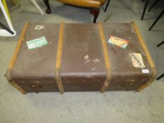 A LARGE VINTAGE BANDED PACKING TRUNK WITH VARIOUS STICKERS TO INCLUDE A NORTHERN STAR EXAMPLE