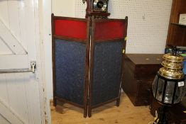 A VINTAGE RED AND BLUE PRESS GLASS TWO FOLD SCREEN